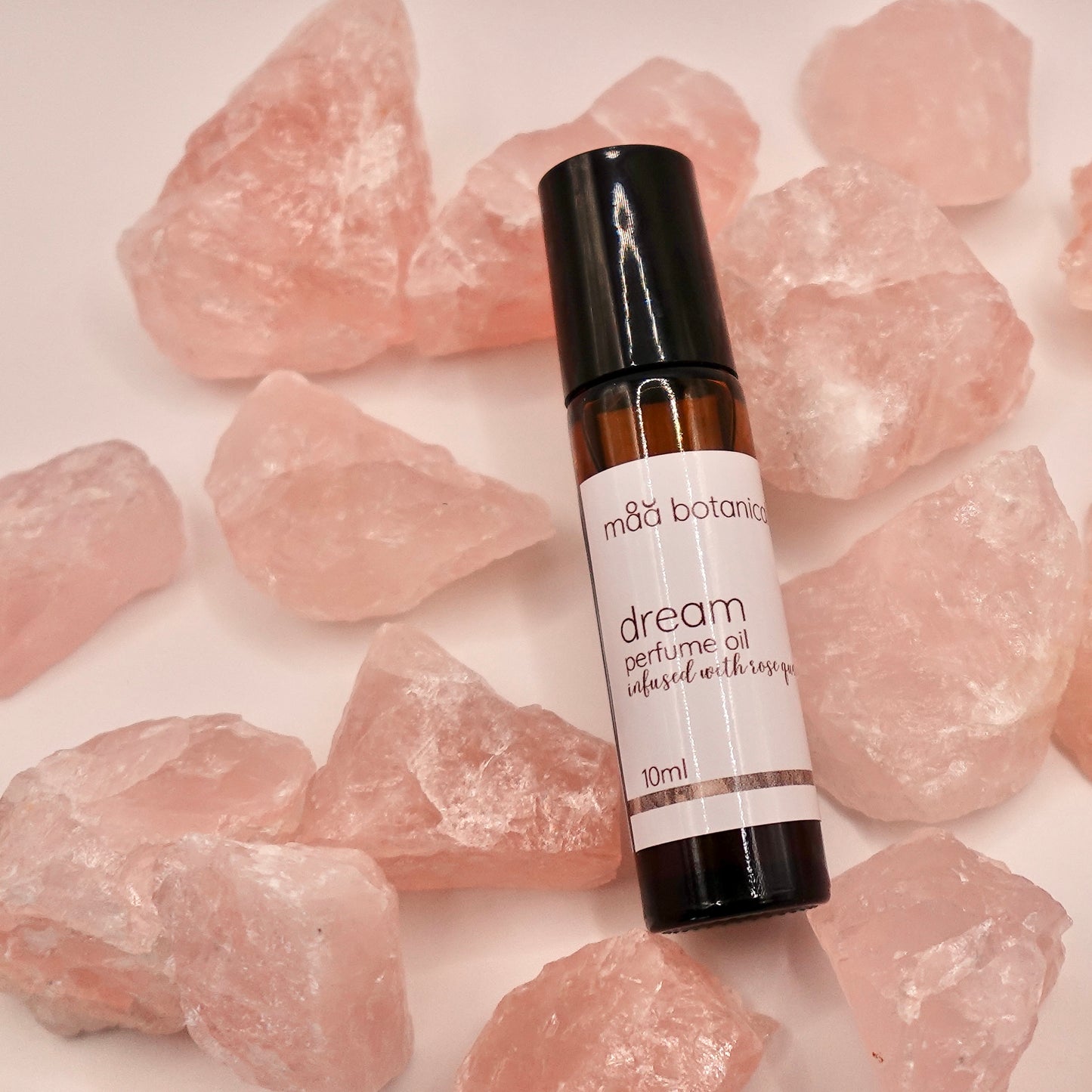 maa botanicals dream perfume oil on rose quartz crystals