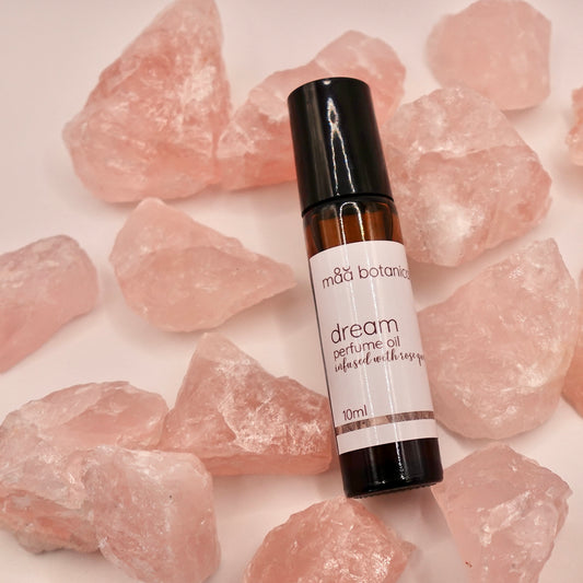 maa botanicals dream perfume oil on rose quartz crystals